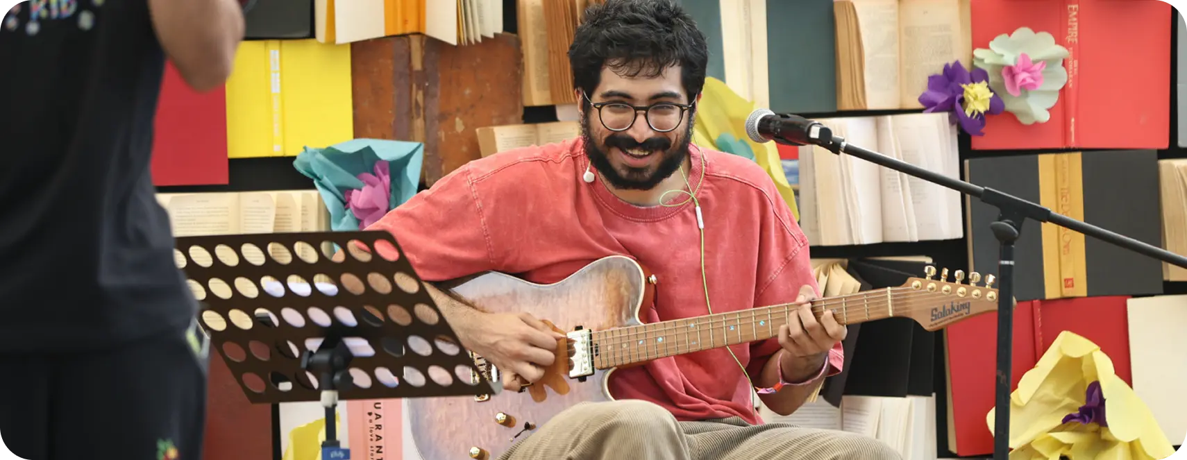 Performer with guitar on stage